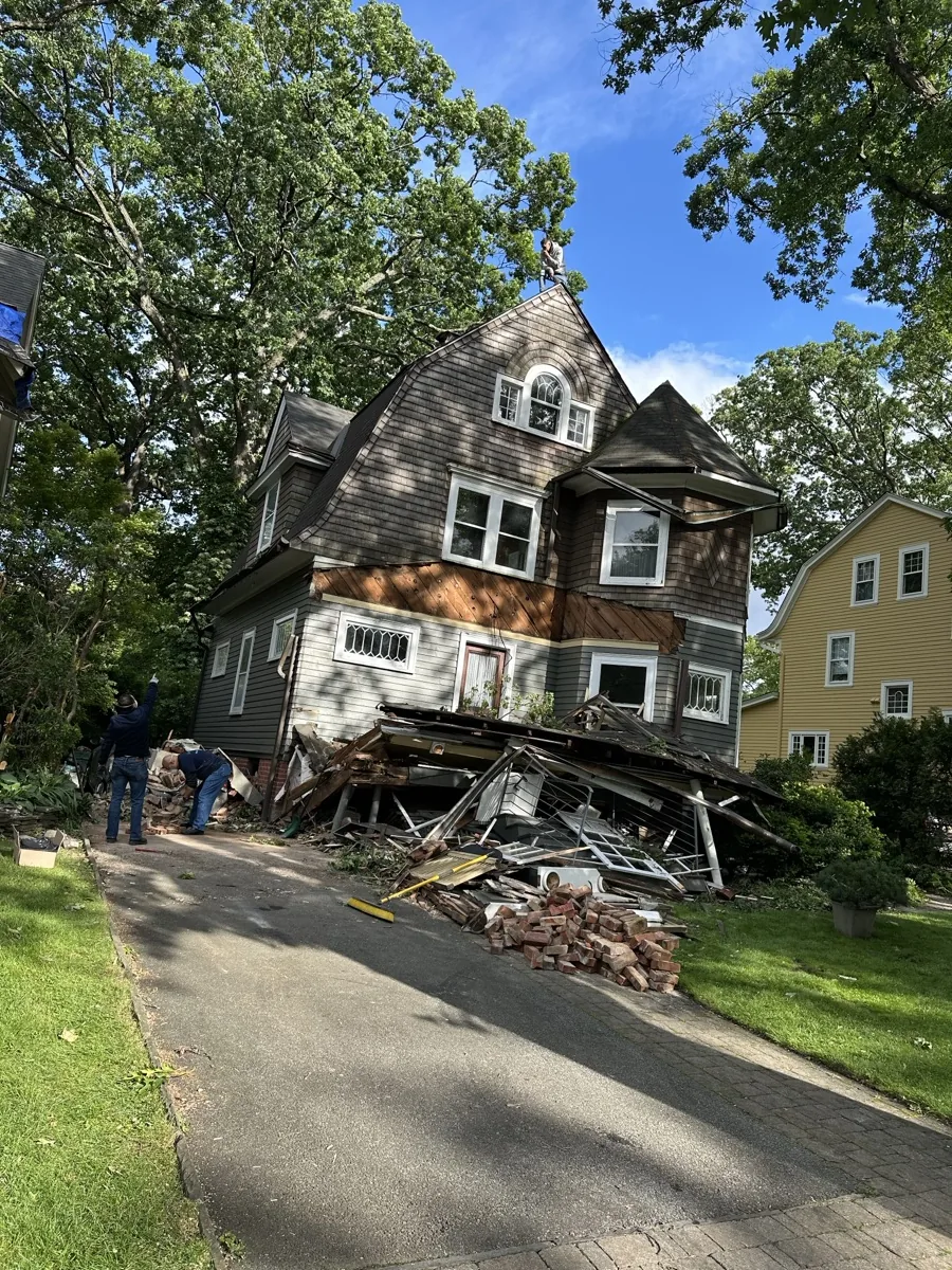Storm-damaged exterior on a North Jersey home needing window and door work