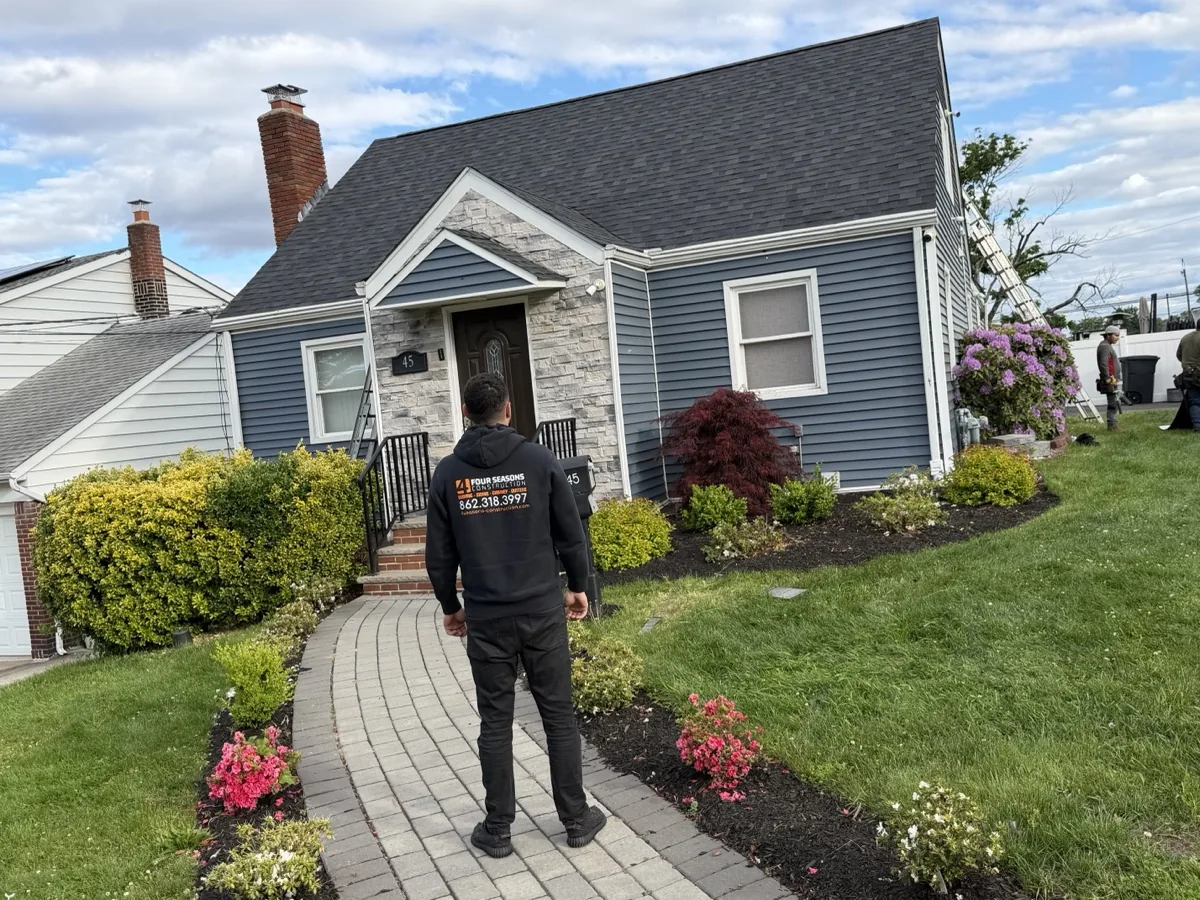 Mason repointing failed brick joints on a Livingston NJ house