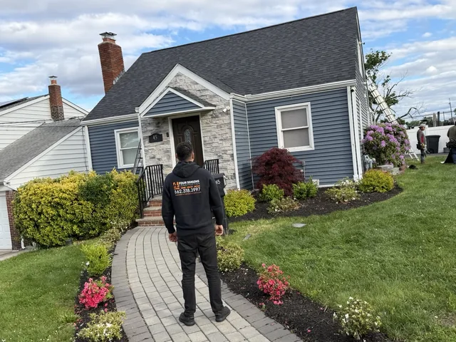 Masonry crew repairing a brick chimney near Little Falls, NJ