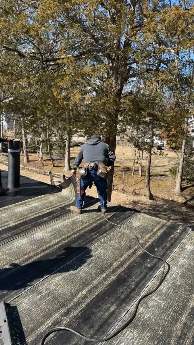 Flat roof repair in progress on a Bloomfield NJ two-family home